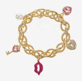 Gold Tone and Pink Charm Bracelet - Reed House of Jewels