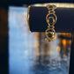 Gold Tone Open Disc with Jet Stone Accents Bracelet - Reed House of Jewels