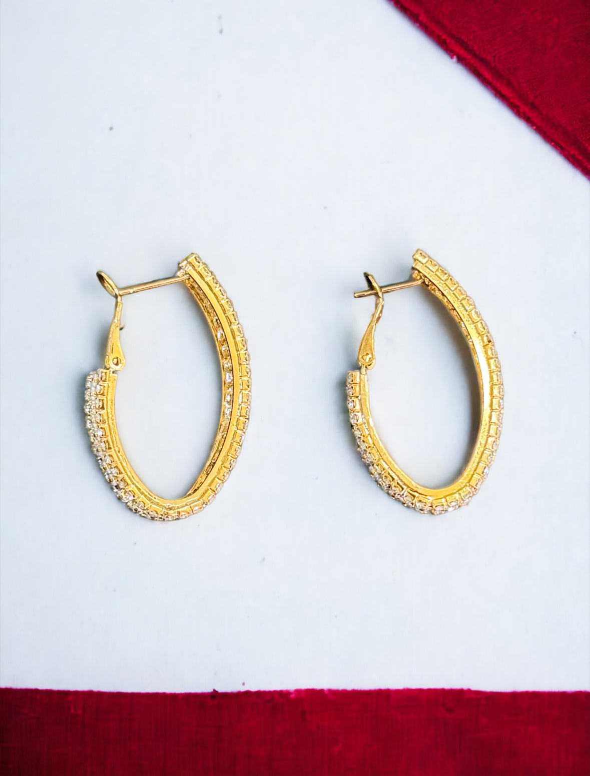 Cubic Zirconia and Gold Tone Oval Hoop Earrings - Reed House of Jewels