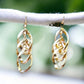 Swirl Drop Gold Tone Earrings - Reed House of Jewels