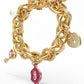 Gold Tone and Pink Charm Bracelet - Reed House of Jewels
