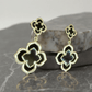 Gold Tone Black Clover Dangle Earrings - Reed House of Jewels