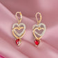 Gold Tone Red Heart and Crystal Double Drop Lever Back Earrings - Reed House of Jewels