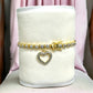 Gold and Diamond Accent 7.25 Inch Heart Charm Tennis Bracelet - Reed House of Jewels