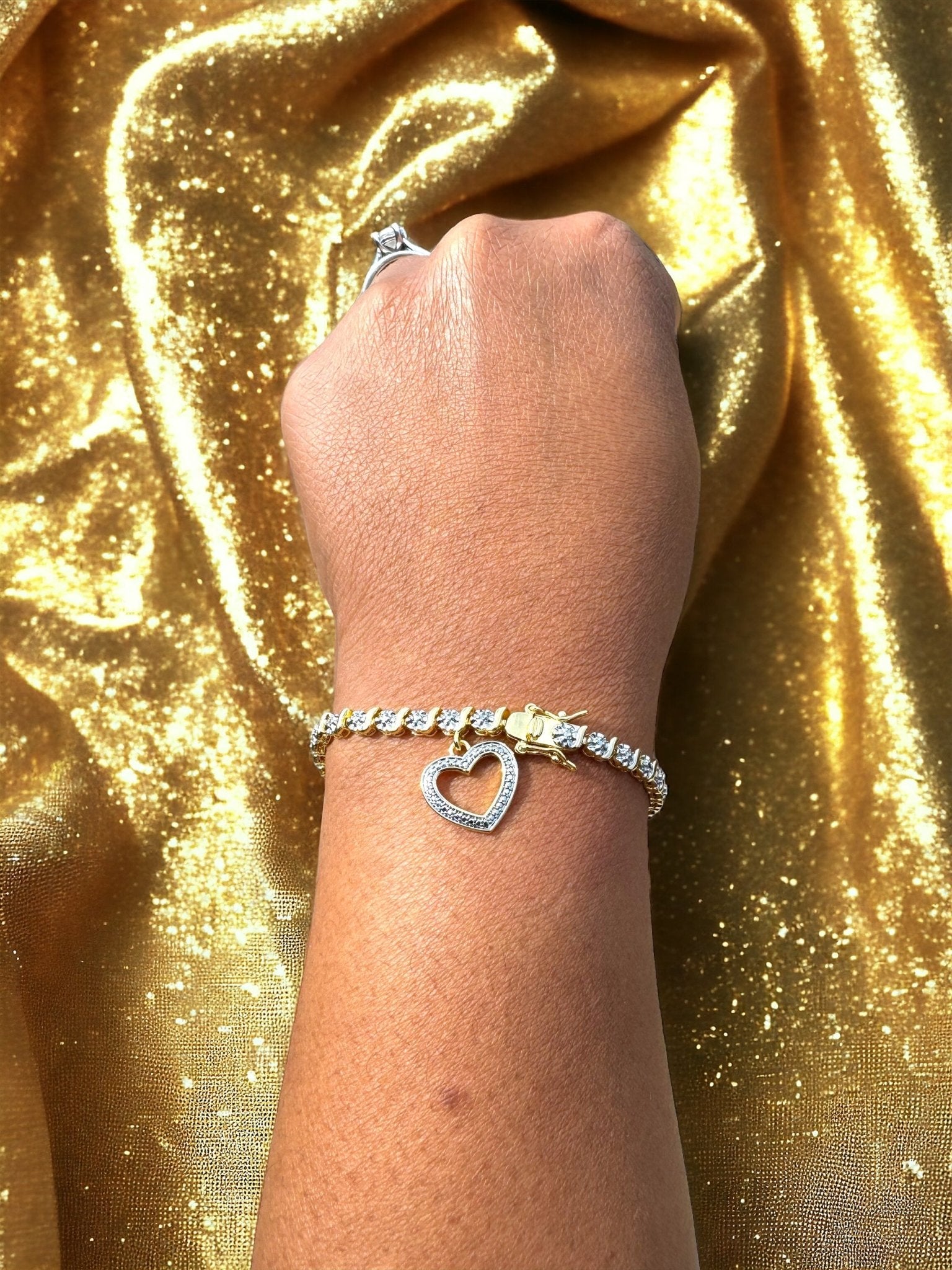 Gold and Diamond Accent 7.25 Inch Heart Charm Tennis Bracelet - Reed House of Jewels