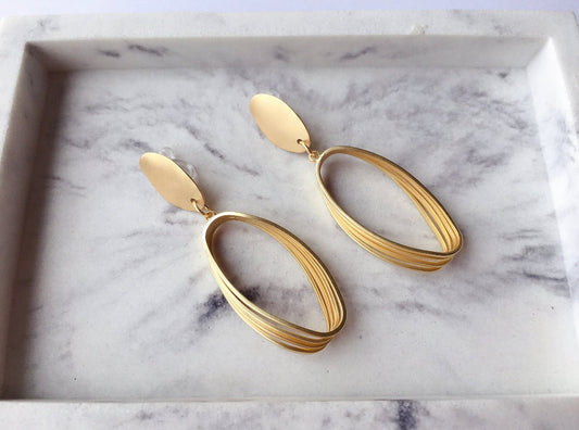 Gold Tone Rugby Clip - on Earrings - Reed House of Jewels