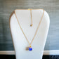 Gold Tone and Sapphire Blue Square Pendant Necklace - Reed House of Jewels