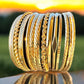 Gold Tone Textured Metal Bangle Stack - Reed House of Jewels