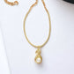 Gold Tone Wrapped Necklace with Gold and Faux Pearl Pendant - Reed House of Jewels