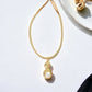 Gold Tone Wrapped Necklace with Gold and Faux Pearl Pendant - Reed House of Jewels